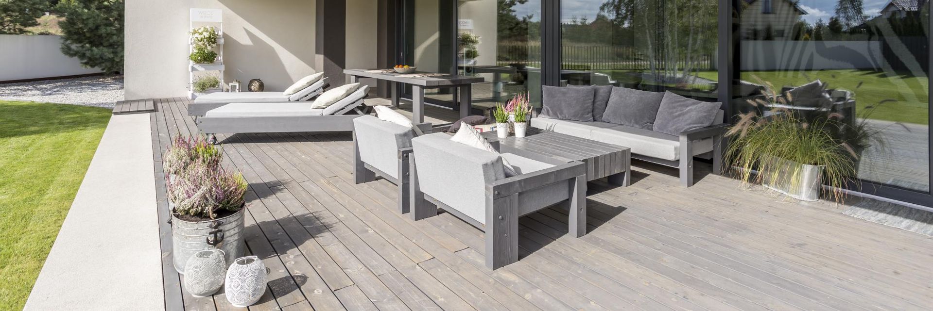 There is a patio with a lot of furniture on it.