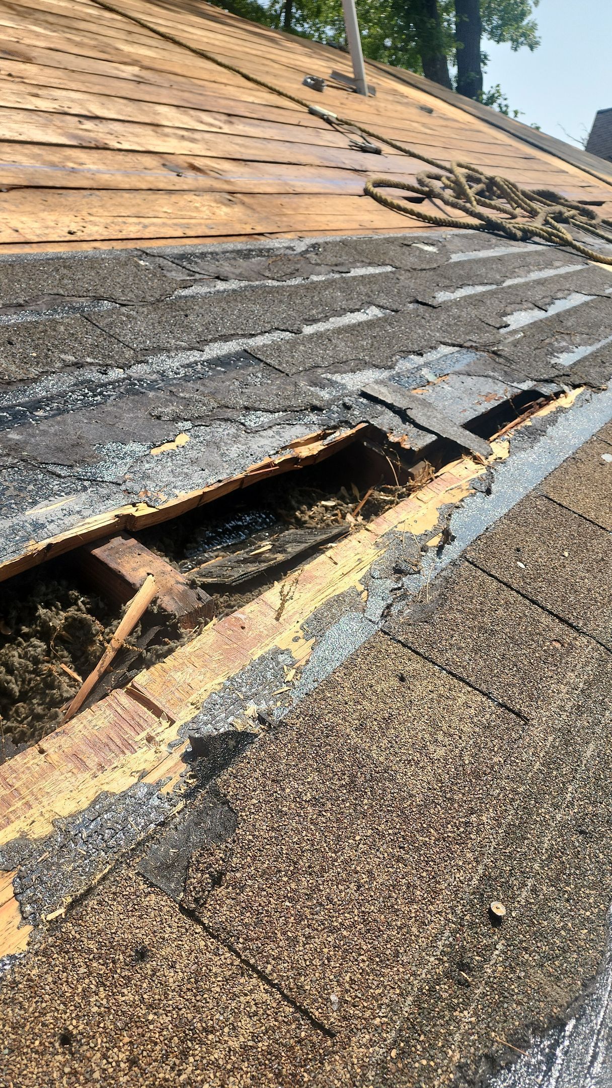 A close up of a roof with a hole in it.