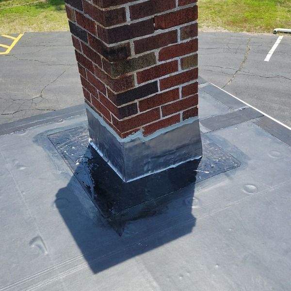 Chimney with new flashing and roof detail