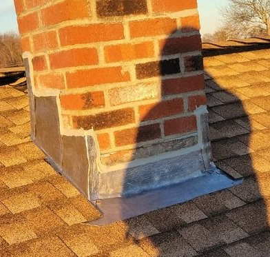 Chimney with new flashing and roof detail