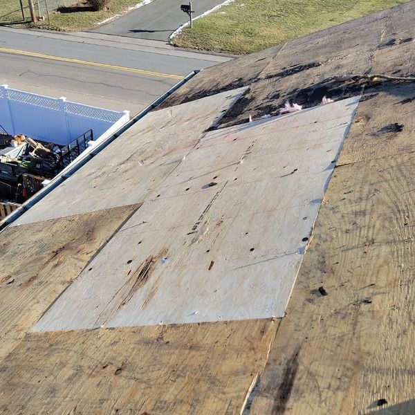 New plywood roof decking installed
