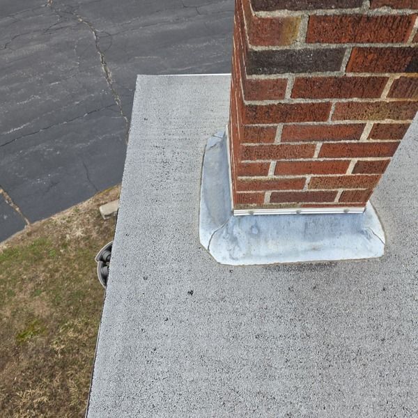 Chimney showing old and worn flashing