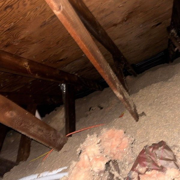 Attic insulation blocking soffit intake ventilation in a Bellingham MA home