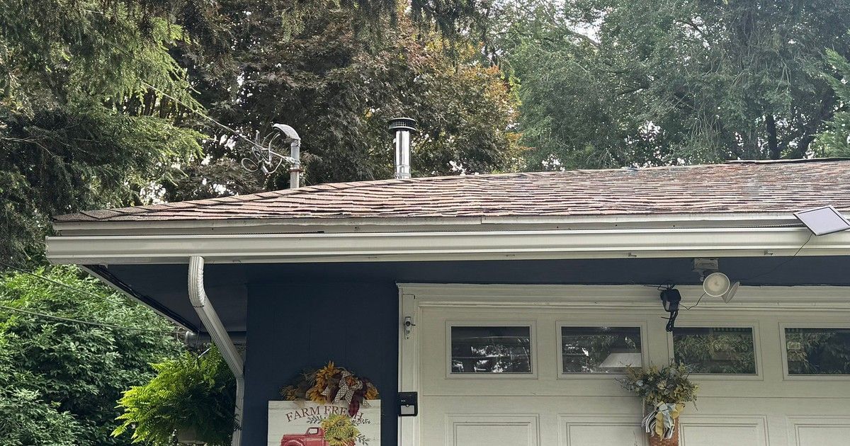 Worn asphalt roof on a 1962 Bellingham MA ranch before roof replacement