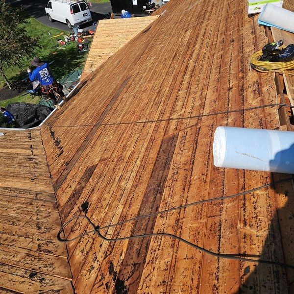 Original wood plank roof decking fully exposed across a 1956 Fitchburg MA ranch home