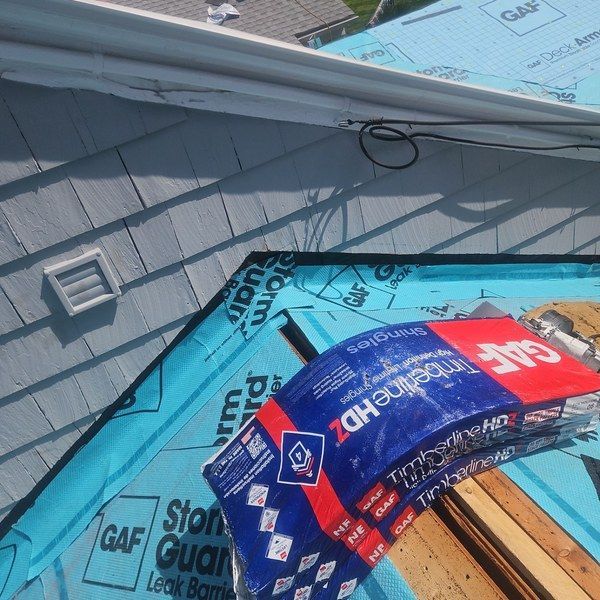 GAF StormGuard leak barrier, Deck-Armor underlayment, and Timberline HDZ shingles on a Fitchburg MA roof