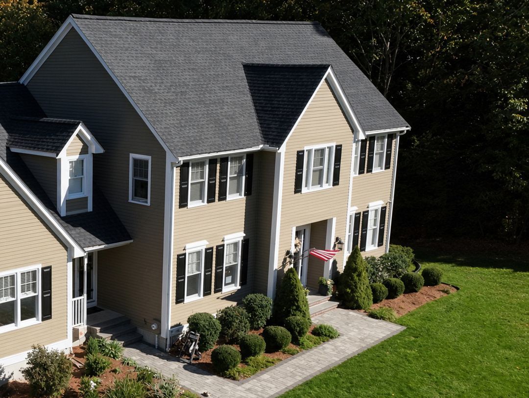 Front view of a 1995 two-story Colonial in Holliston MA with a new GAF Timberline UHDZ shingle roof