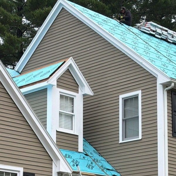 GAF StormGuard leak barrier and Deck-Armor underlayment installed on a Colonial’s main roof and dormer during a Holliston MA roof replacement