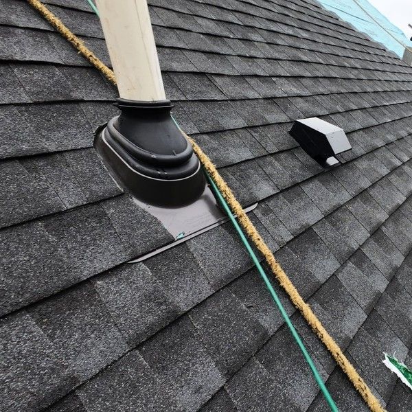 New heavy-duty plumbing vent pipe boot and bathroom exhaust vent on a GAF Timberline UHDZ shingle roof in Holliston MA