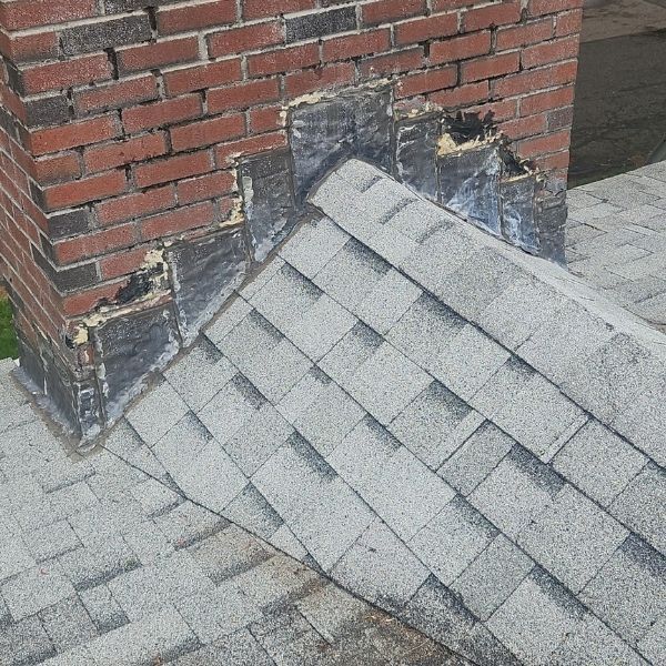 Chimney with old roof flashing