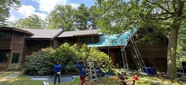 Wooded home with roof under construction