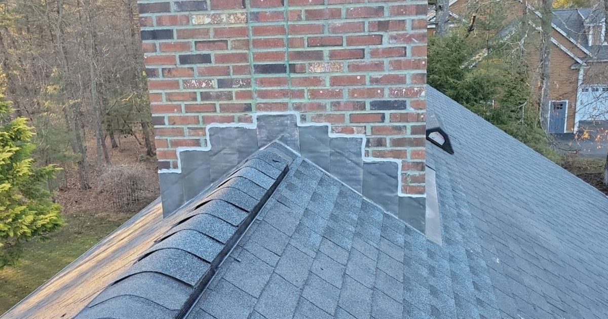 Properly installed flashing and shingles around a chimney