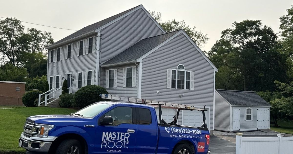 Lowell home with Master Roof truck in the driveway