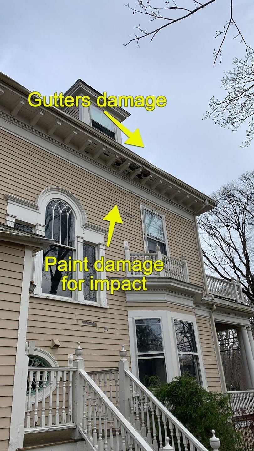 A tan house with yellow arrows pointing to damaged gutters and chipped exterior paint on the siding.