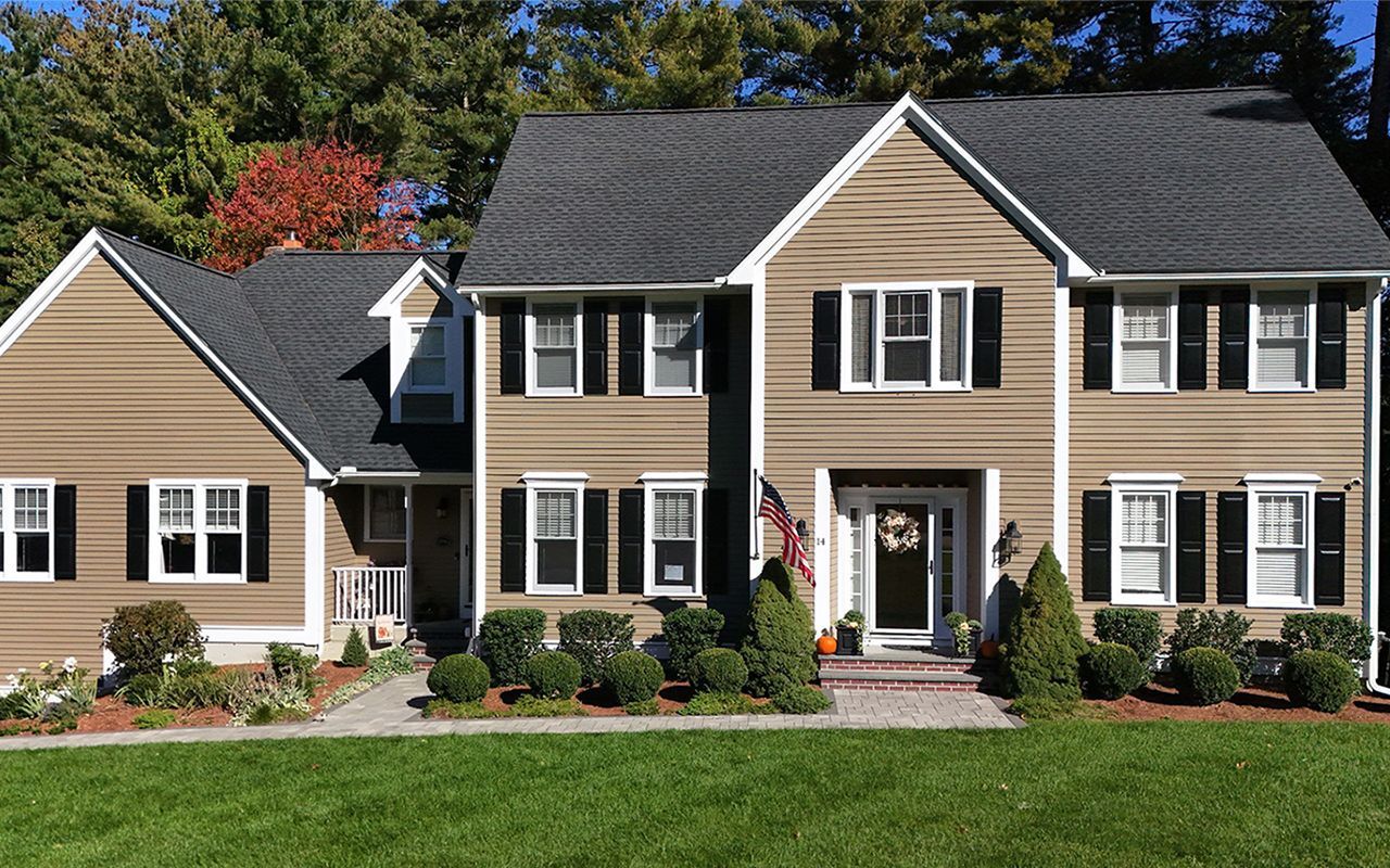 Home with new, charcoal colored roof