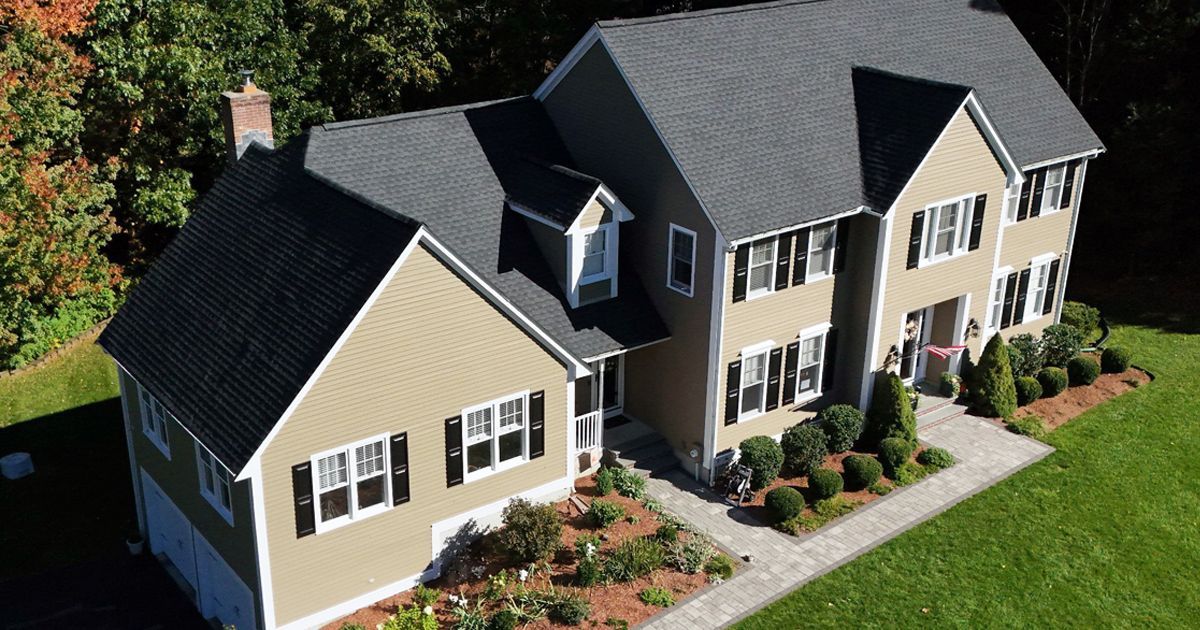 Home with new, charcoal colored roof
