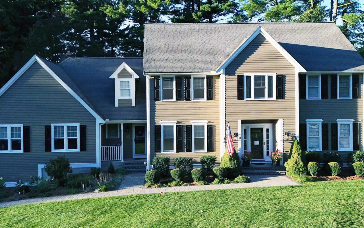Home with worn, gray roof