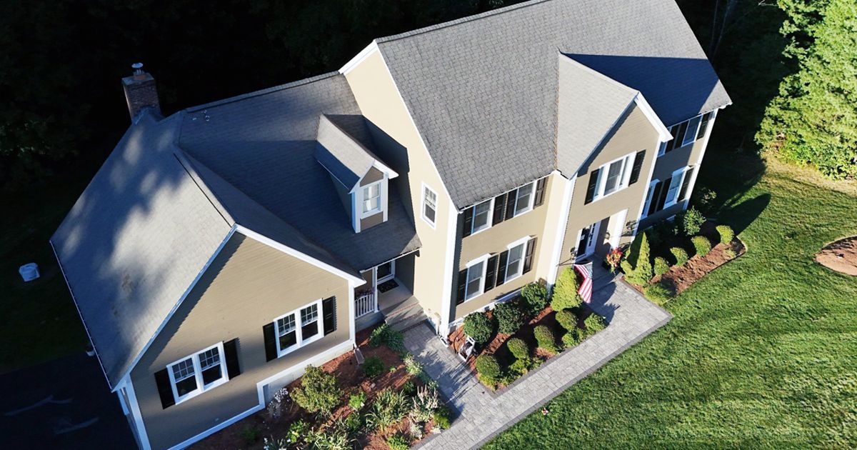 Home with worn, gray roof