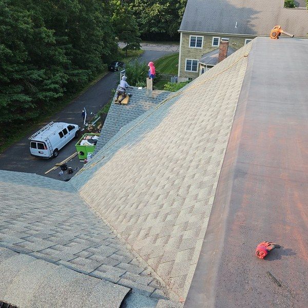 Completed two-system roof replacement with new shingles and low-slope membrane in Medfield MA.