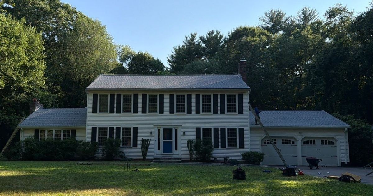 Yellow home with a new roof.