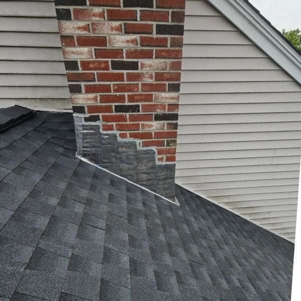 Chimney with new flashing and shingles