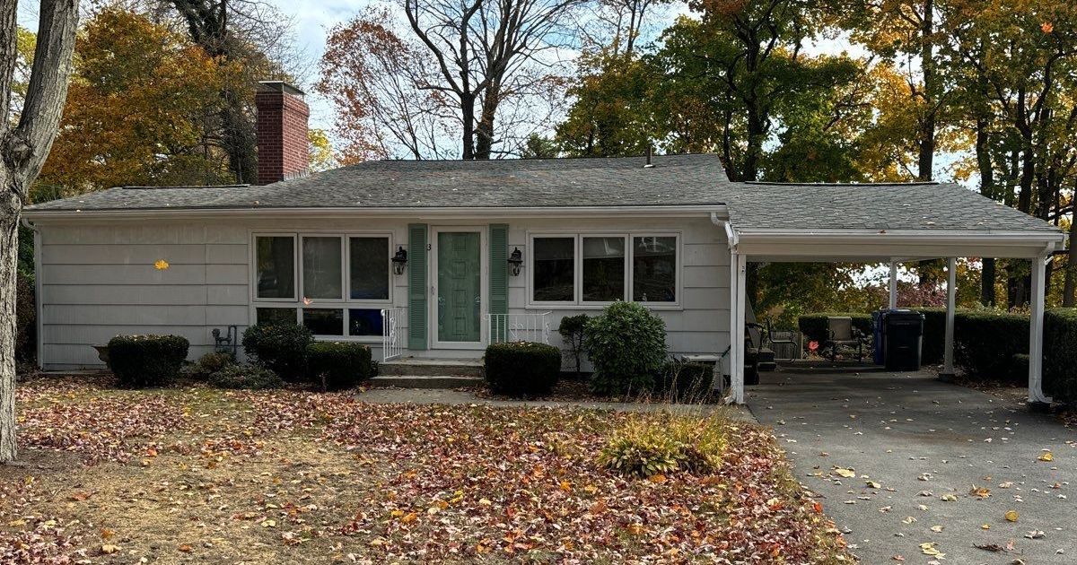 mid-century home with aging roof