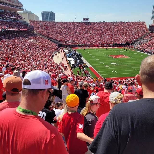 Memorial Stadium filled with fans in red, seen from the upper deck