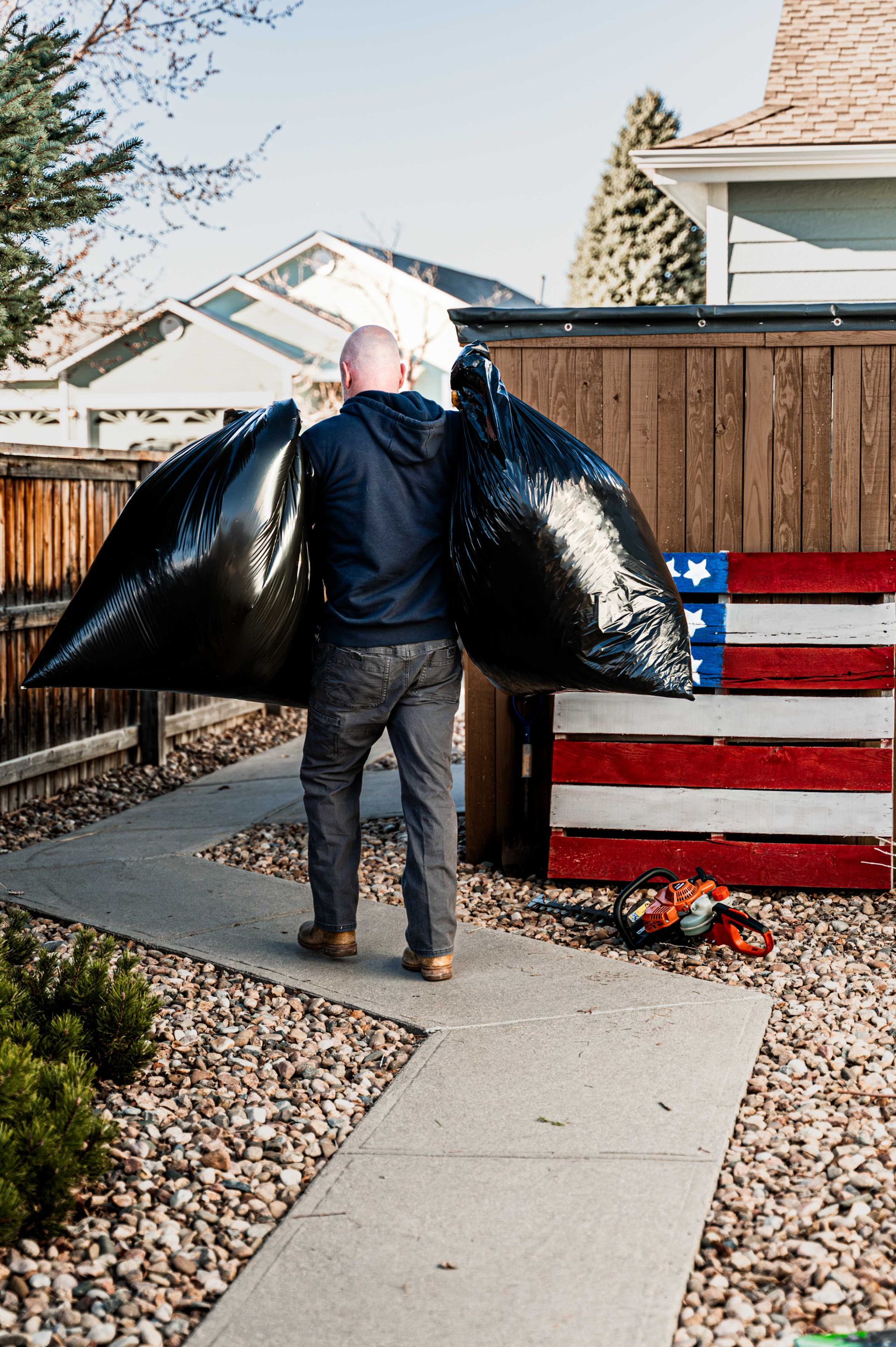  Halftime Help crew hauling away yard debris during a leaf clean up in Highlands  Ranch Colorado
