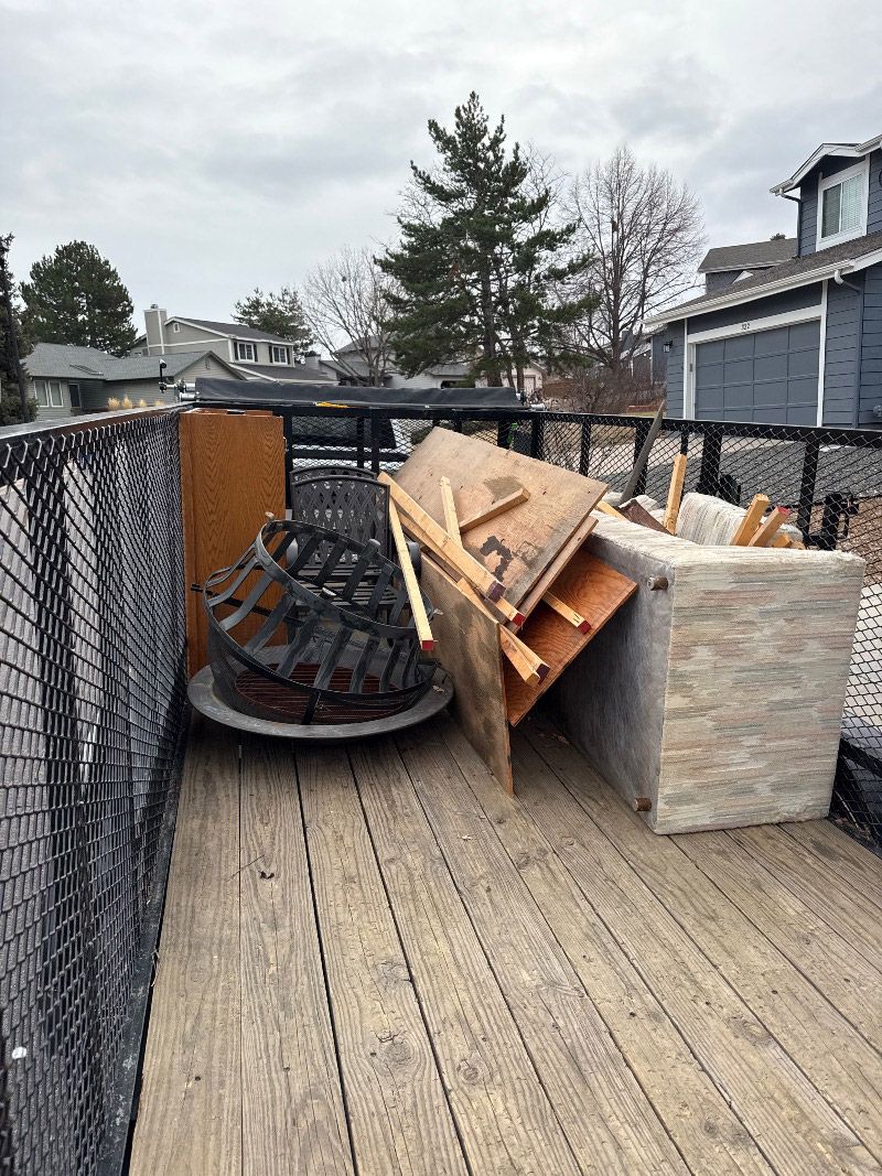 Halftime Help removing furniture and debris from a residential property in Highlands Ranch Colorado