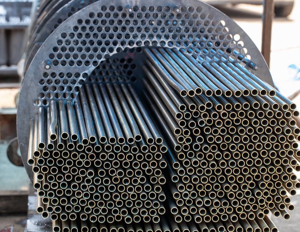 A Bunch of Metal Pipes Are Stacked on Top of Each Other — On The Spot Steel Fabrication in Caloundra West, QLD