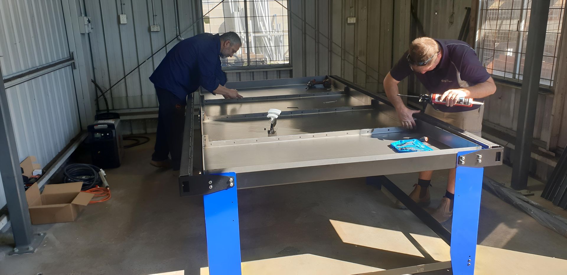 Two Men Are Working — On The Spot Steel Fabrication in Caloundra West, QLD