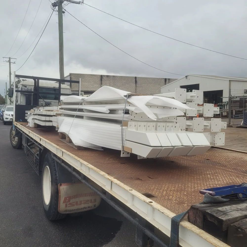 A Truck Carrying a Bunch of White Metals — On The Spot Steel Fabrication in Caloundra West, QLD