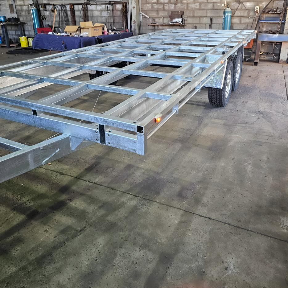 Large Metal Trailer is Sitting in a Garage — On The Spot Steel Fabrication in Caloundra West, QLD