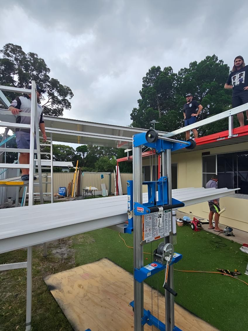 People Are Working on a Scaffolding in Front of a House — On The Spot Steel Fabrication in Caloundra West, QLD