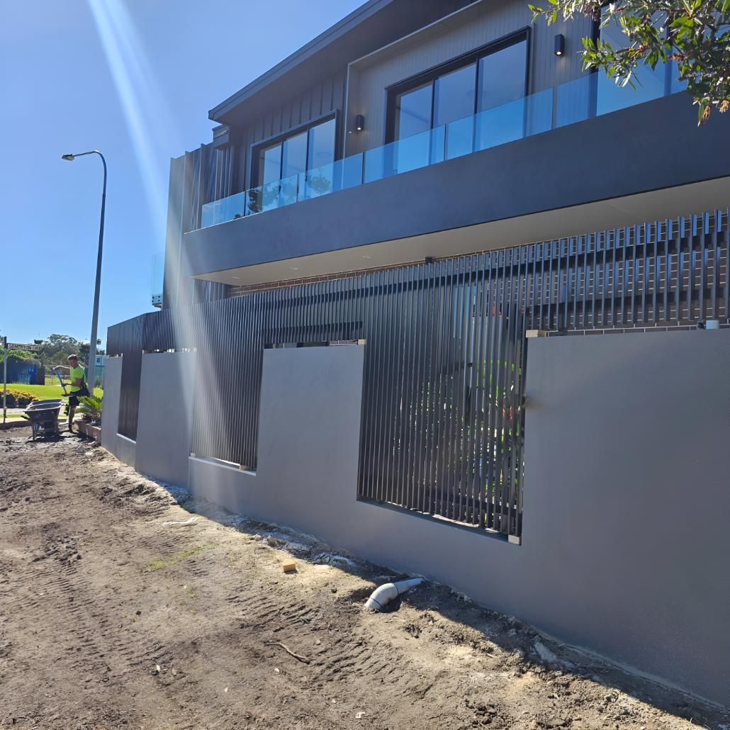 Large House With a Fence Around It is Being Built — On The Spot Steel Fabrication in Caloundra West, QLD