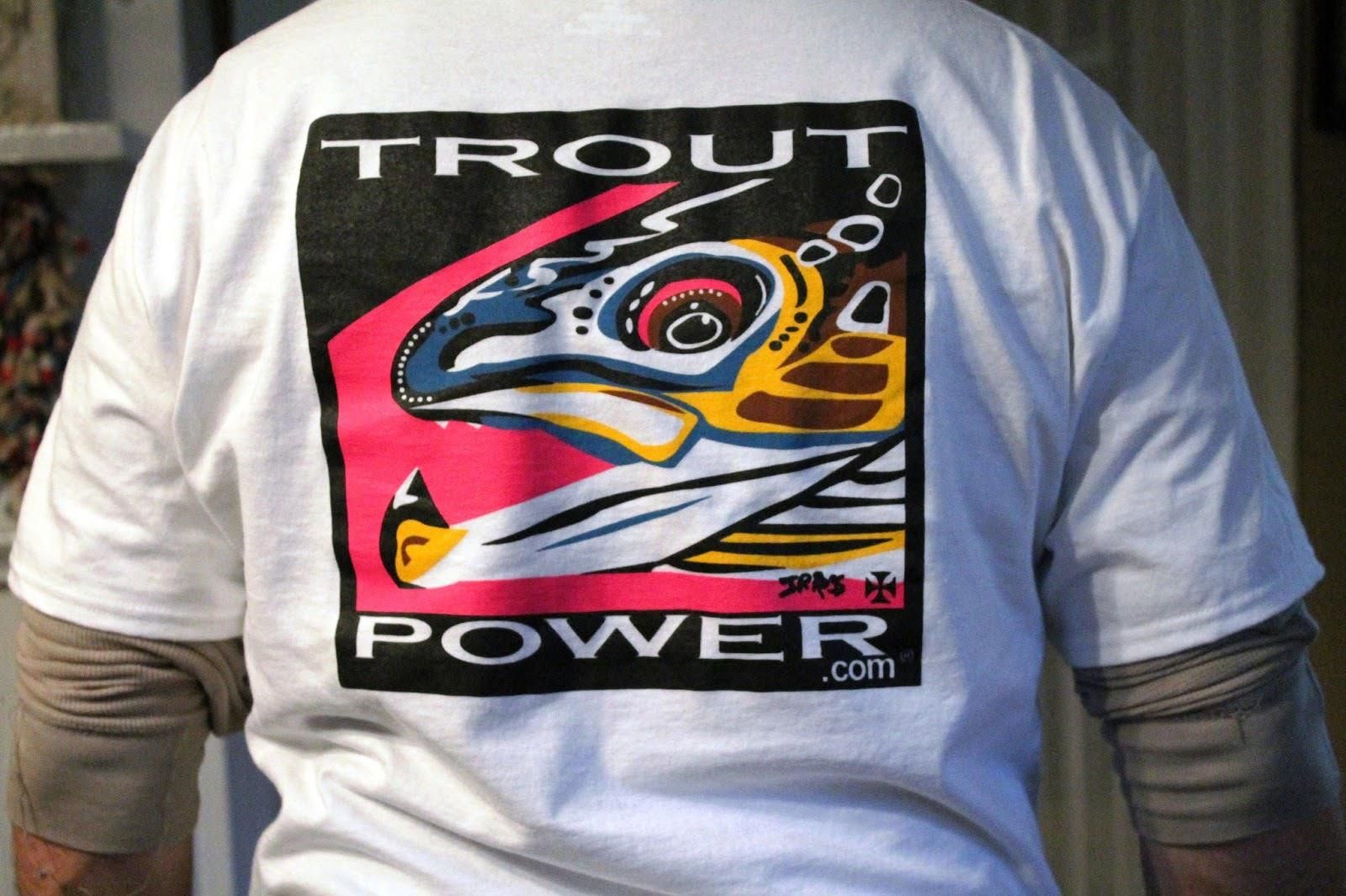 Person wearing a white T-shirt with a colorful trout graphic and the words “TROUT POWER” on the back