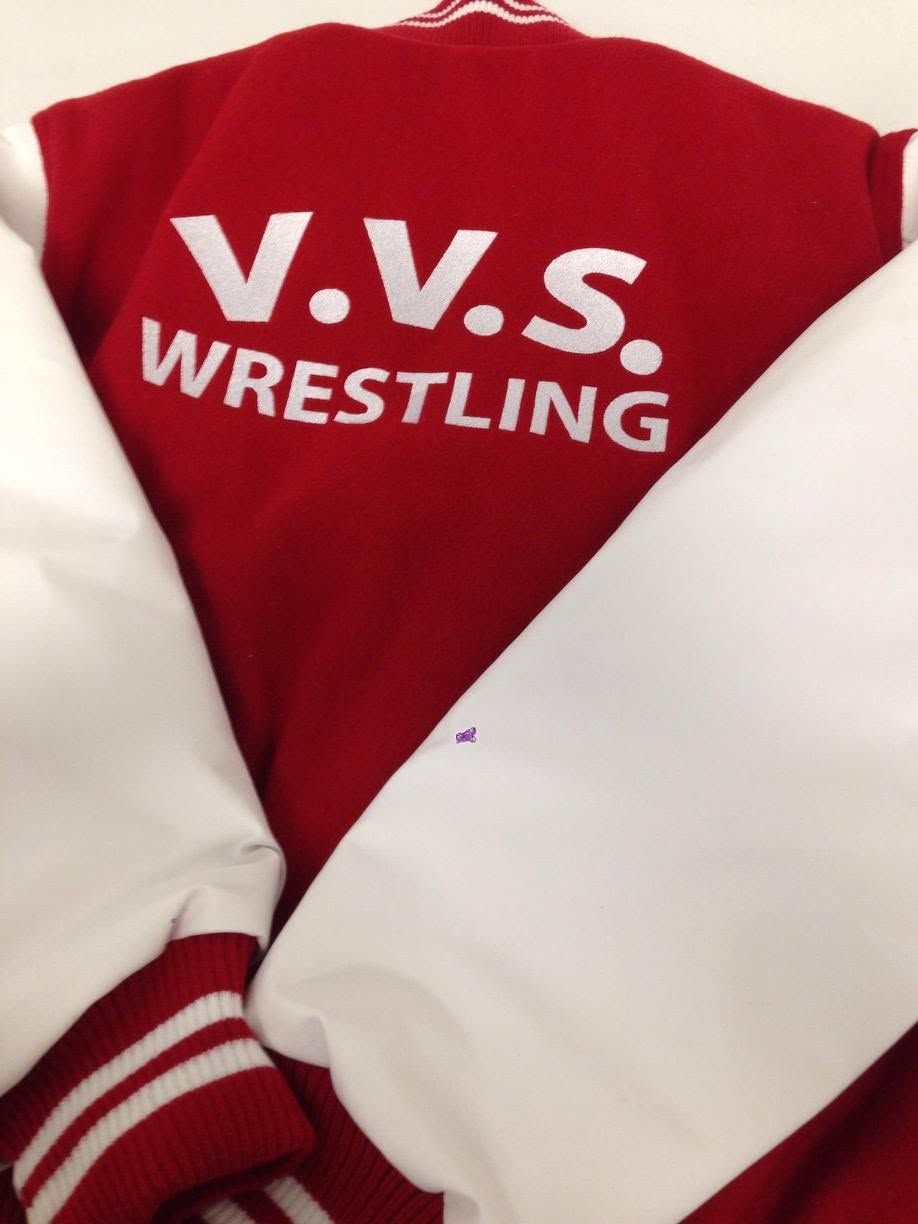 Red and white varsity jacket with “V.V.S. WRESTLING” lettering