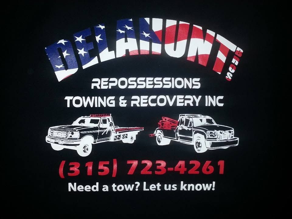 Delaware Repossessions Towing & Recovery Inc sign with cars, phone number, and “Need a tow? Let us know!”