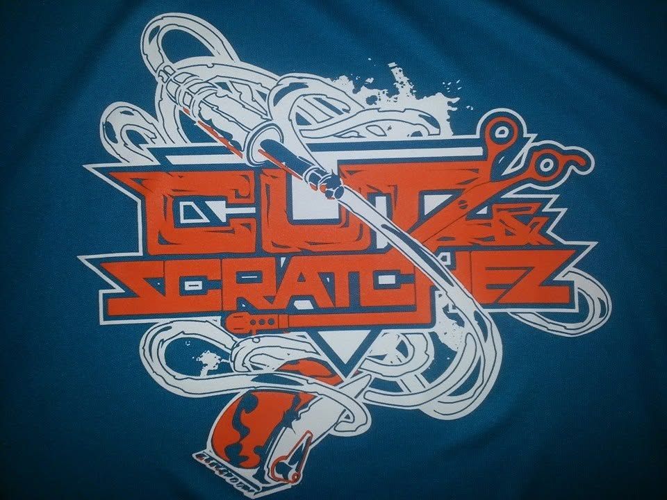 Abstract orange and white skate logo on blue background, with a skateboard and tangled graphic lines