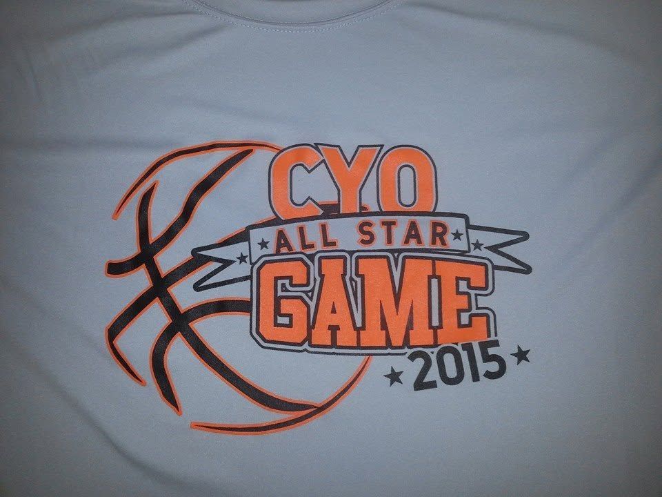 CYO All Star Game 2015 logo on a white T-shirt, featuring an orange basketball and bold text
