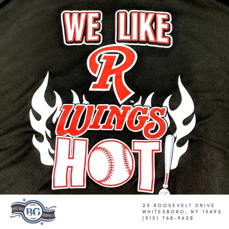 Black shirt graphic: “We Like R Wings Hot” in red and white with flaming wings and a baseball.
