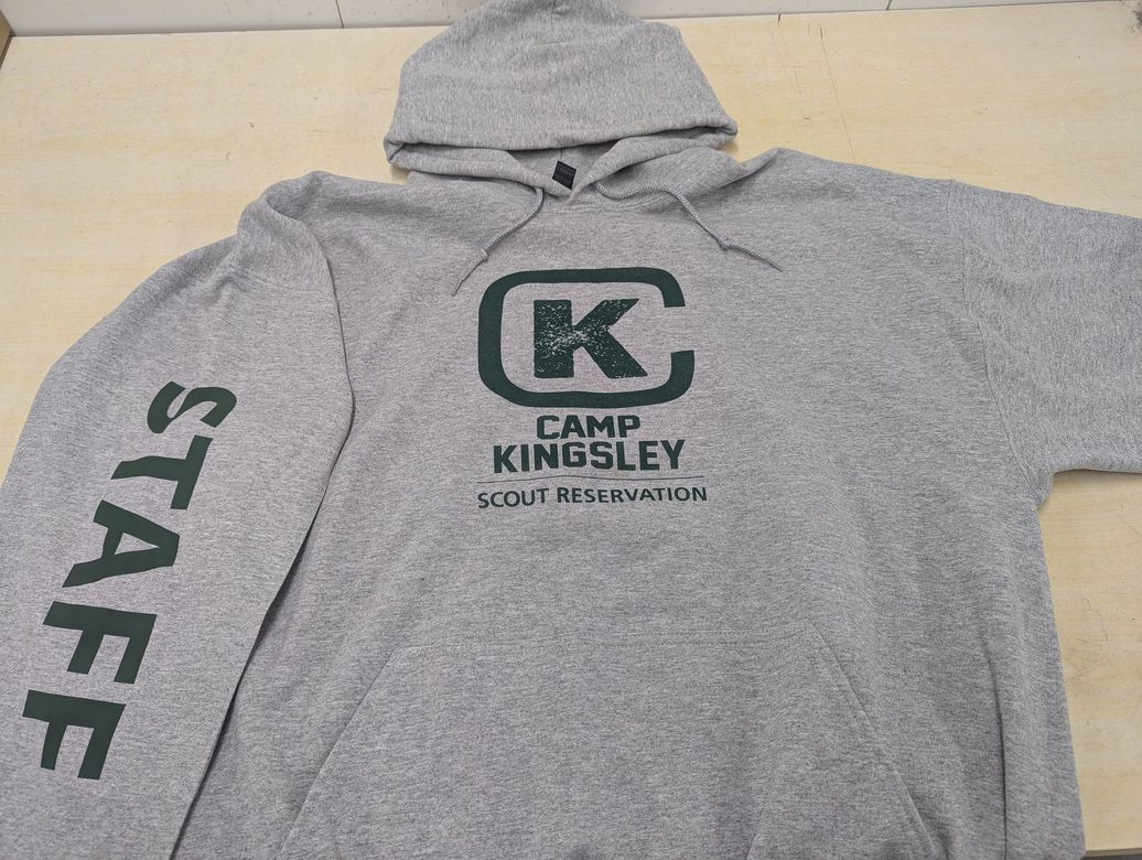 Gray hooded sweatshirt with "CAMP KINGSLEY" logo and "STAFF" printed on the sleeve.