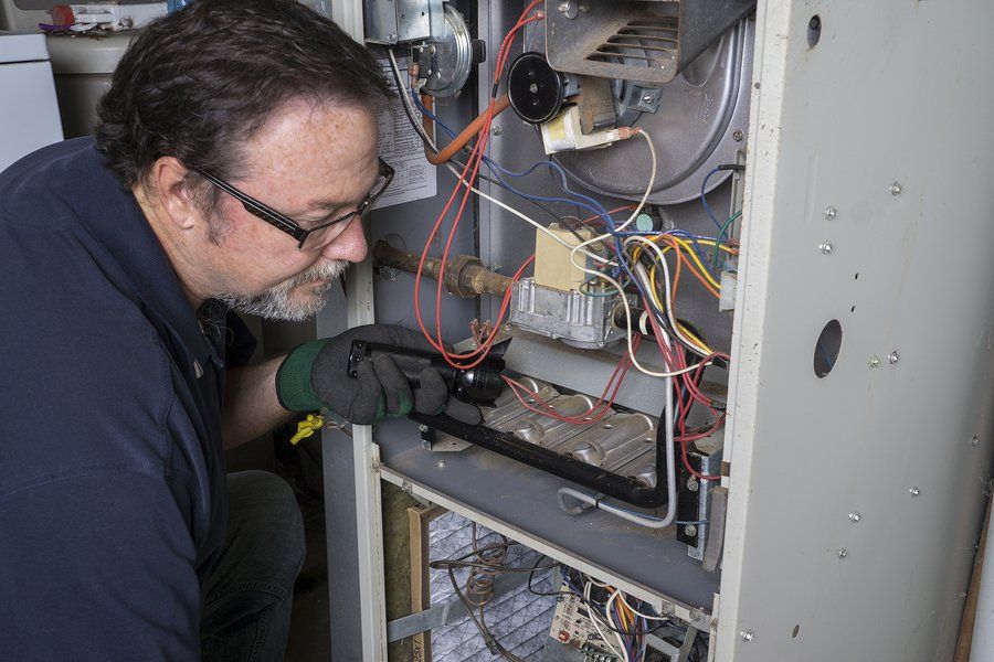 male electrician fixing the wirings