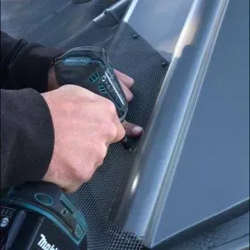 screw the All-Flow Gutter Guard to the ridge capping
