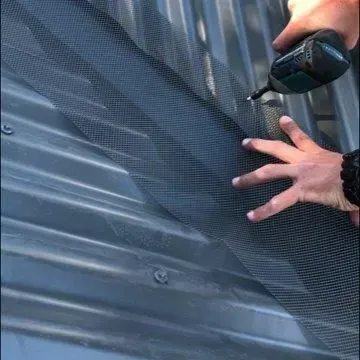 centre the gutter guard and screw in position