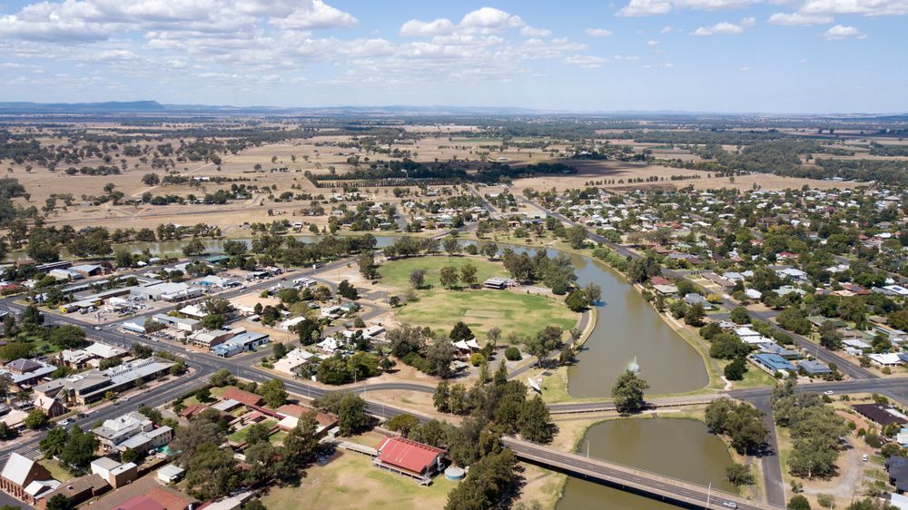 Aerial View of a Small Town With a River Running Through It — Pure Plumbing & Electrical in Forbes, NSW