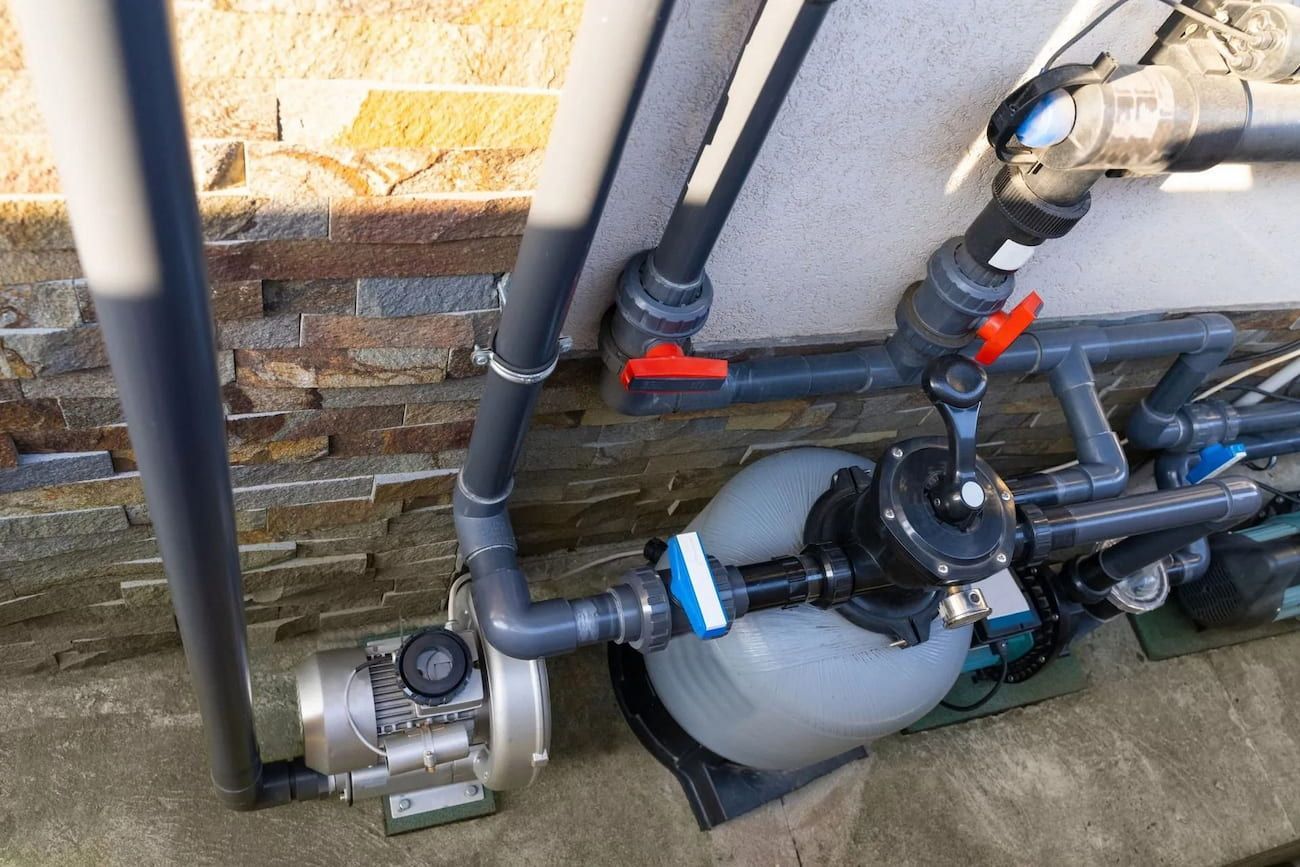 Pool Pump and Filter System With Gray Pipes, Valves, and Electrical Components — Pure Plumbing & Electrical in Dubbo, NSW