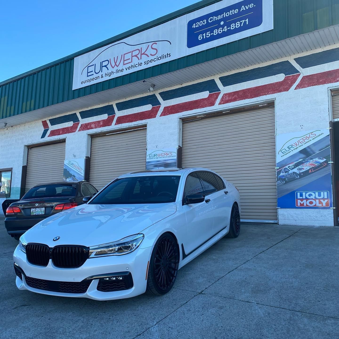 White BMW Parked Outside EurWerks Auto Shop Building | EurWerks