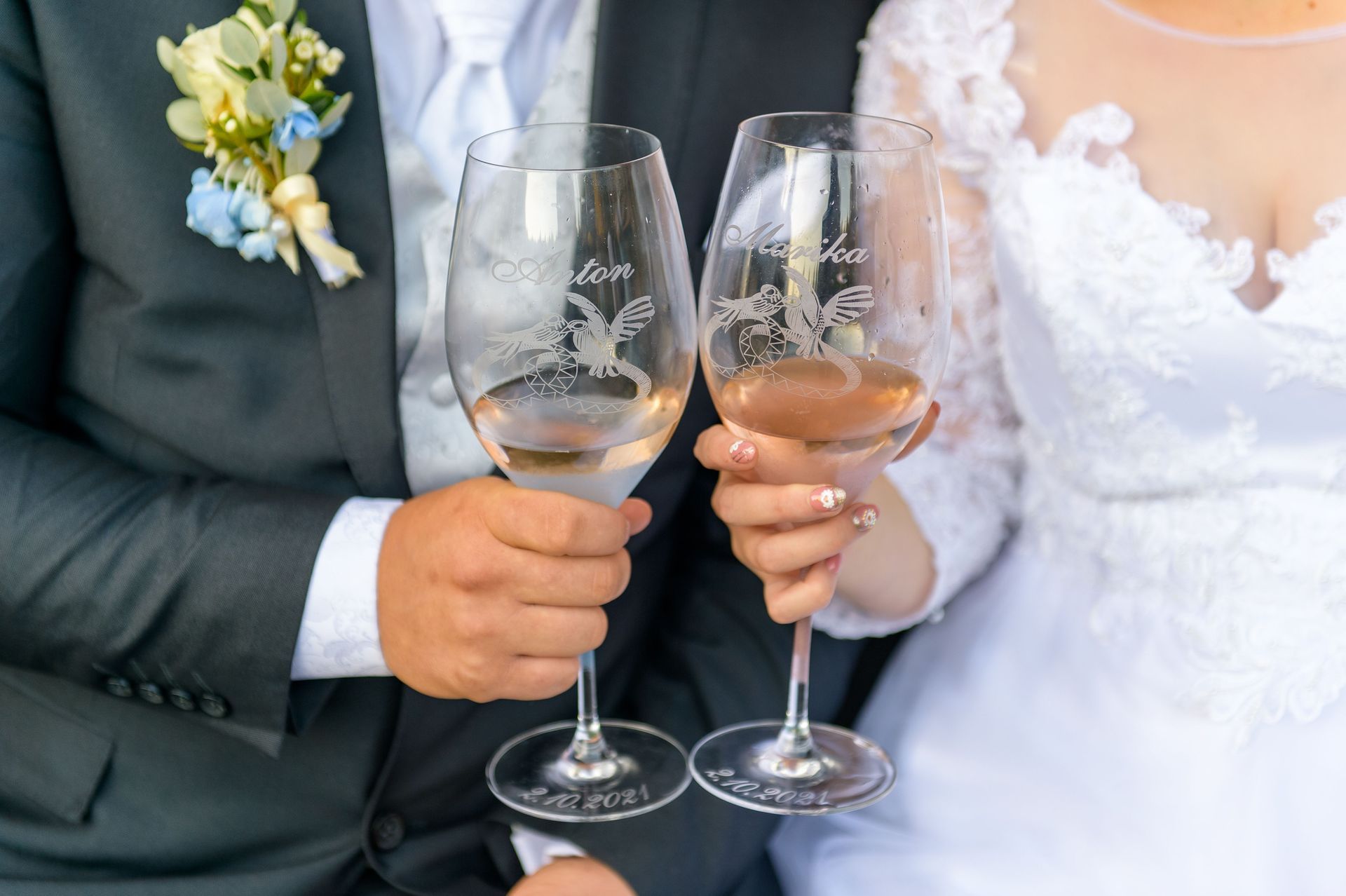 Bride and groom holding wine glasses during a wedding toast