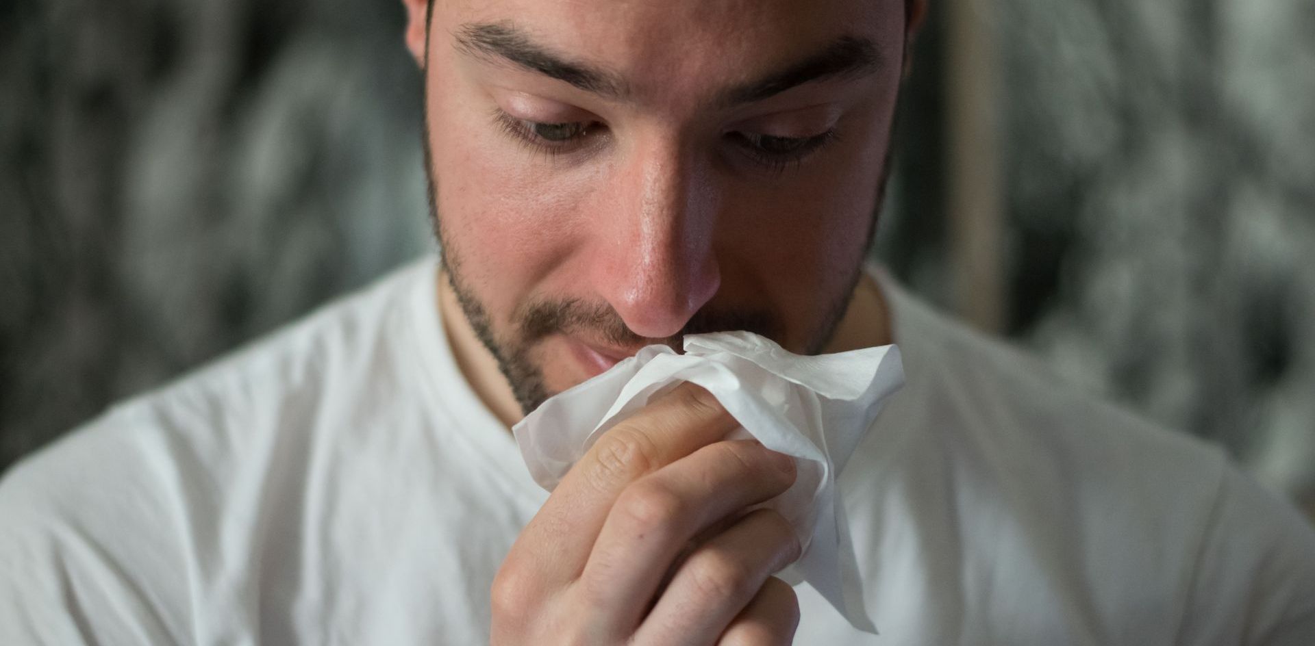 man with tissue